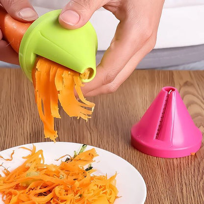Coupe légumes spiraliseur manuel – spirales de carotte déposées sur une assiette blanche pour une présentation élégante