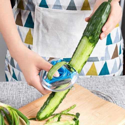 Éplucheur bleu 3‑en‑1 ergonomique pour éplucher les légumes avec précision dans une cuisine moderne.
